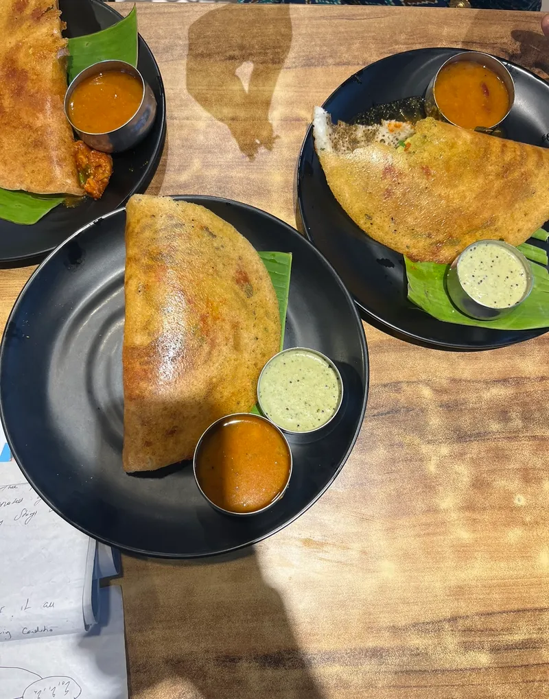 Crispy South Indian Dosa served with traditional chutneys and sambar - travel culinary journey