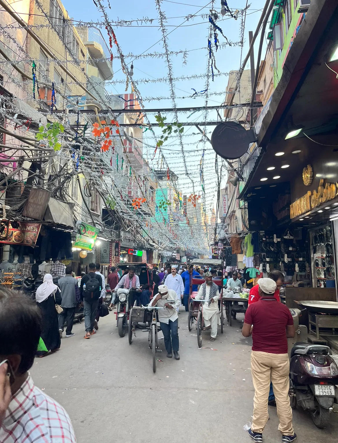 Delhi travel photography - vibrant and bustling historic market street in Old Delhi, India
