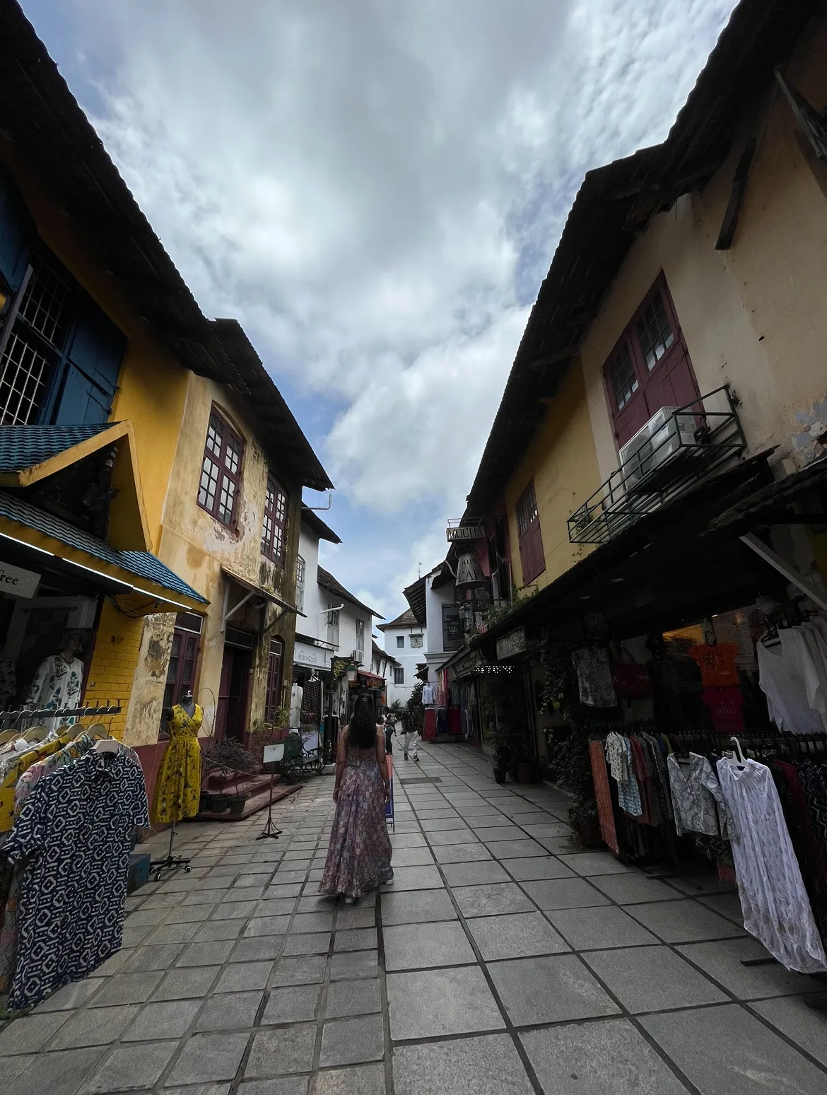 Fort Kochi heritage walk - historic street lined with old Portuguese style buildings and giant rain trees