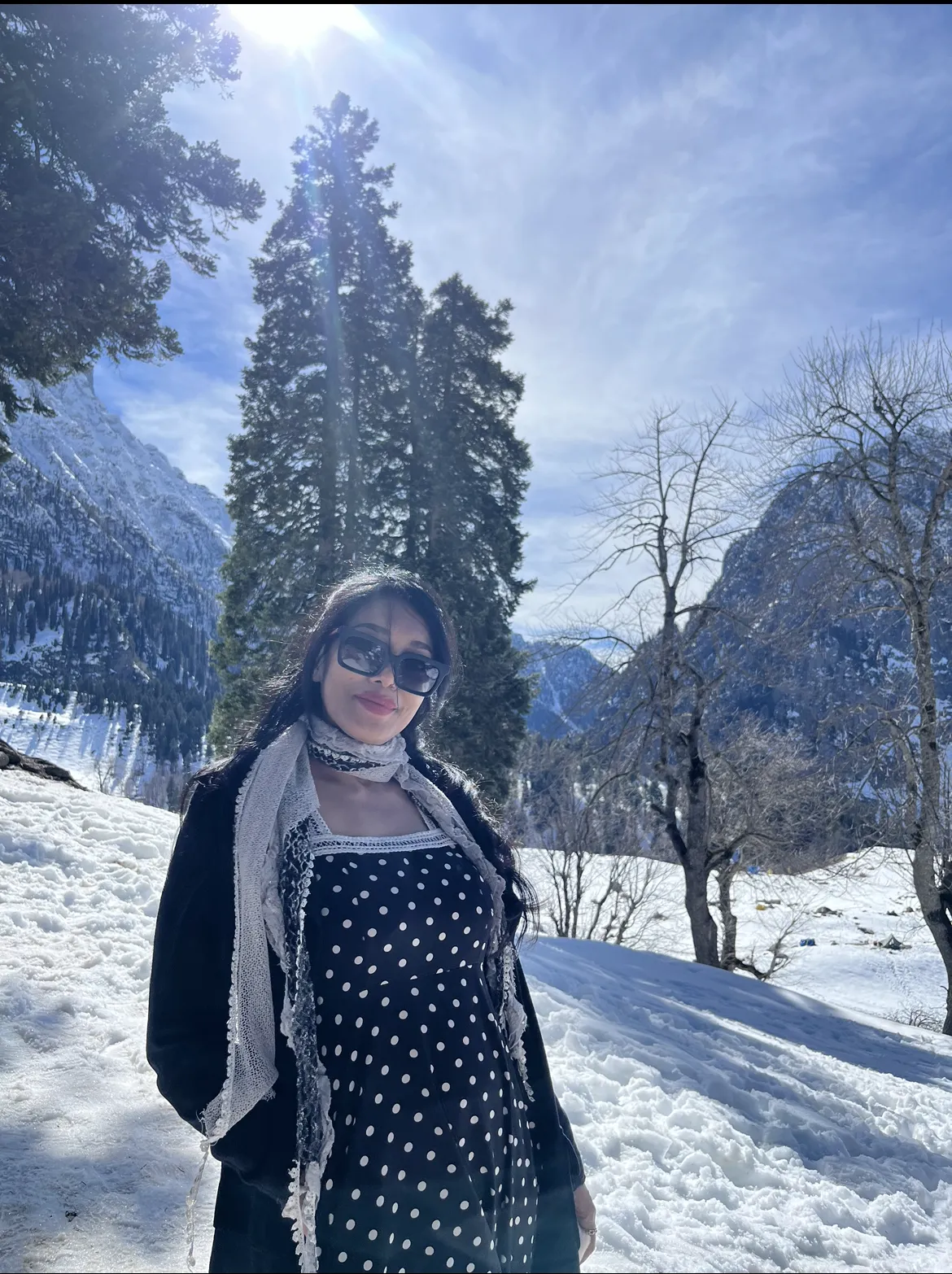 Sonamarg travel photography - snow-covered mountains, pine trees, and winter valley in Kashmir